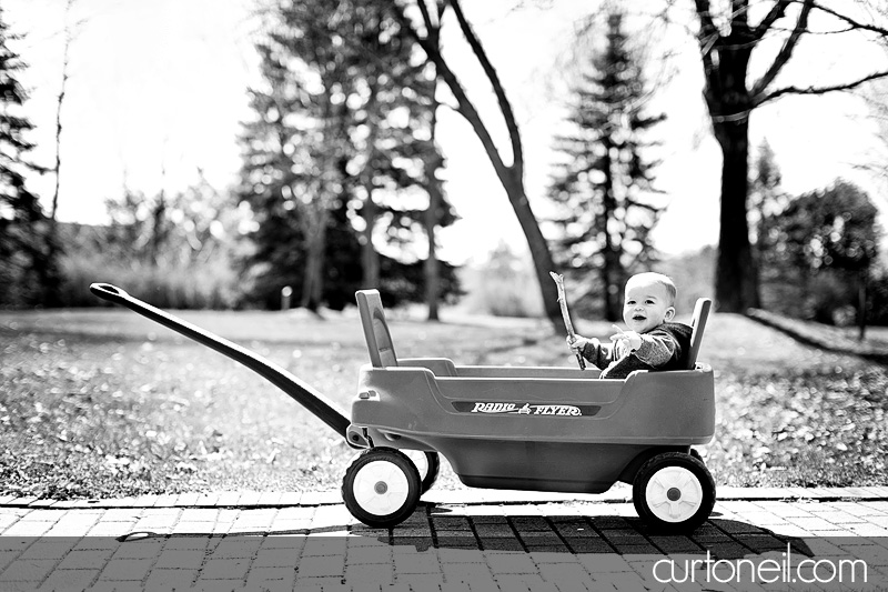 Sault Ste Marie Baby Photographer - Connor at 1 yr - Rolling in his Radio Flyer at the Arboretum