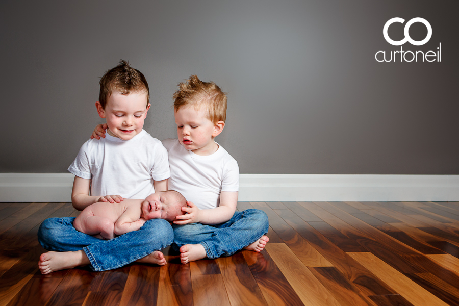 Sault Ste Marie Baby Photography - Cruz at 13 days old - a little help from his brothers