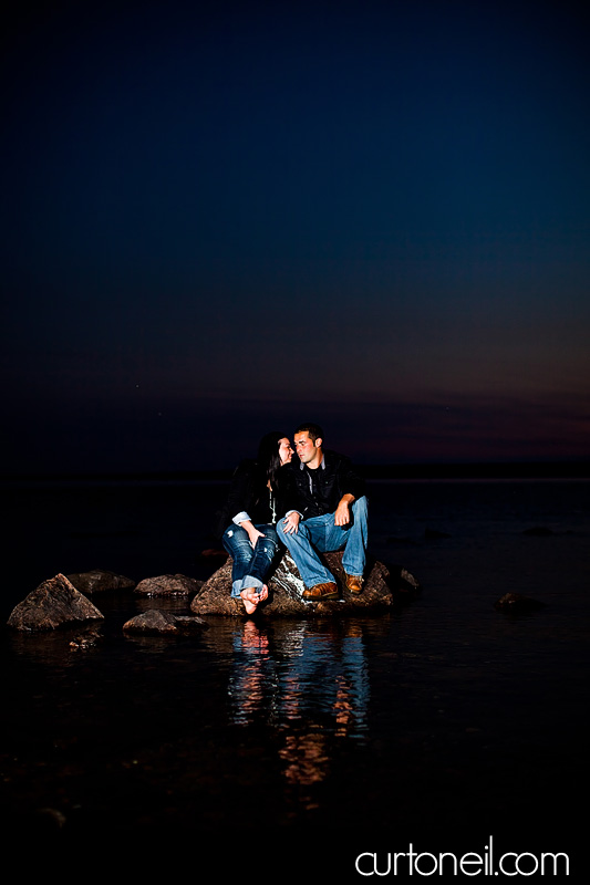 Sault Ste Marie Engagement Photography - Alysha and Jake - on a rock in the water at Gros Cap sneak peek