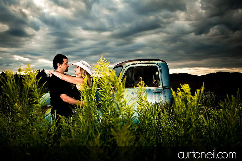 Sault Ste Marie Engagement Photography - Carol and Rob - Field with old Chevy truck, Pointe Des Chenes beach