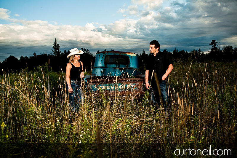 Sault Ste Marie Engagement Photography - Carol and Rob - Field with old Chevy truck, Pointe Des Chenes beach