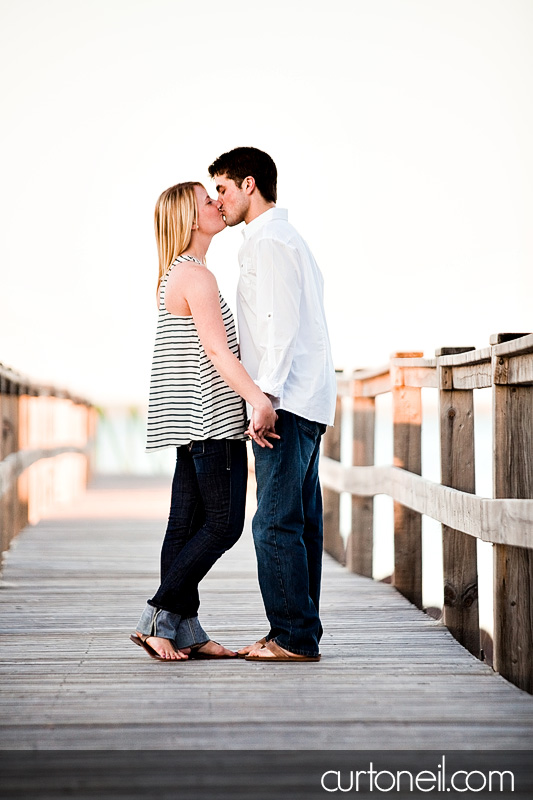Sault Ste Marie Engagement Photography - Chelsea and Trevor - boardwalk kiss