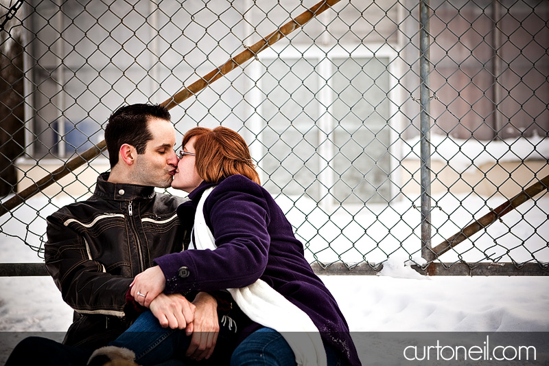 Engagement Shoot - Nikki and Jason chain link fence