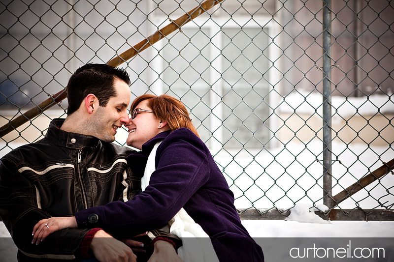Engagement Shoot - Nikki and Jason chain link fence