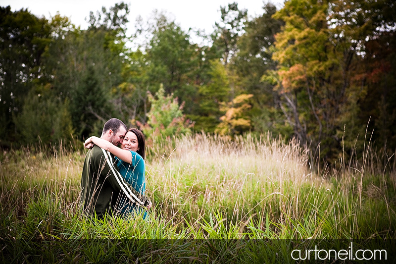 Sault Ste Marie Engagement Photography - Sonia and Jason - in the grass