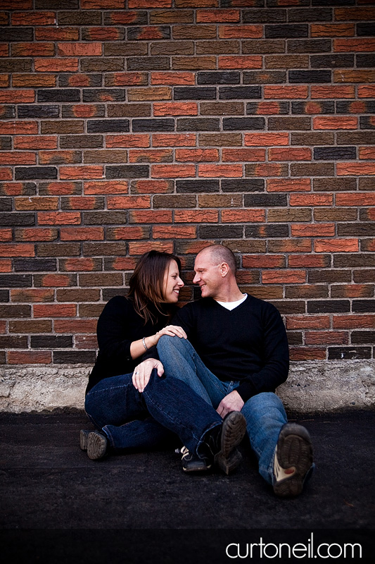 Engagement Shoot - sitting against the wall