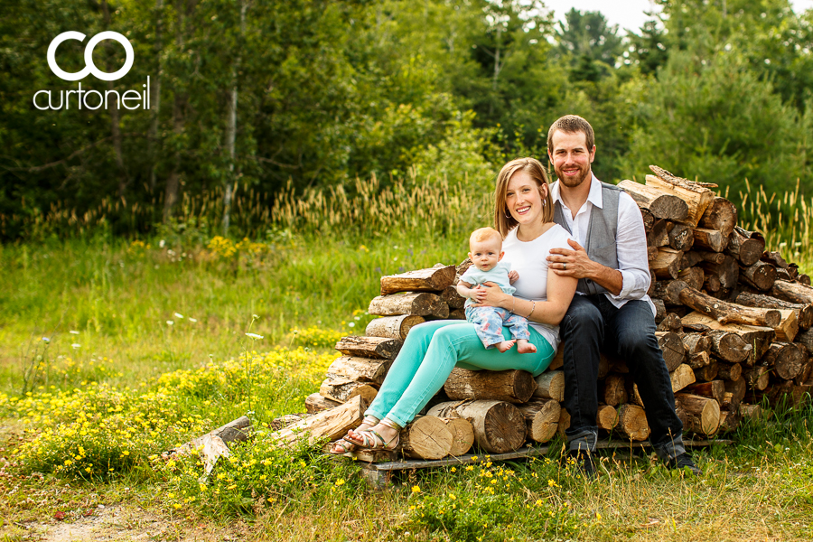Sault Ste Marie Family Photography - MacKenzie Family - sneak peek at the Trading Post on a wood pile