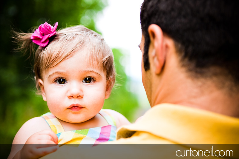 Macy at 9 months - baby photography - being held by dad