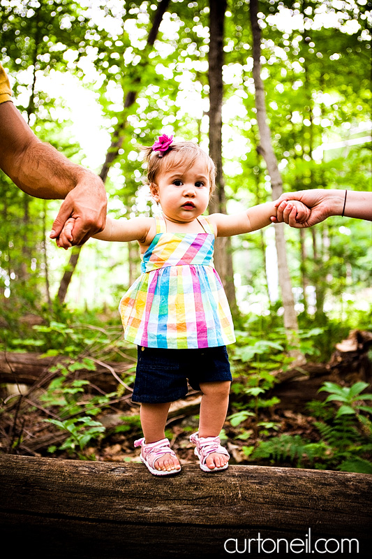 Macy at 9 months - baby photography - balancing on a log