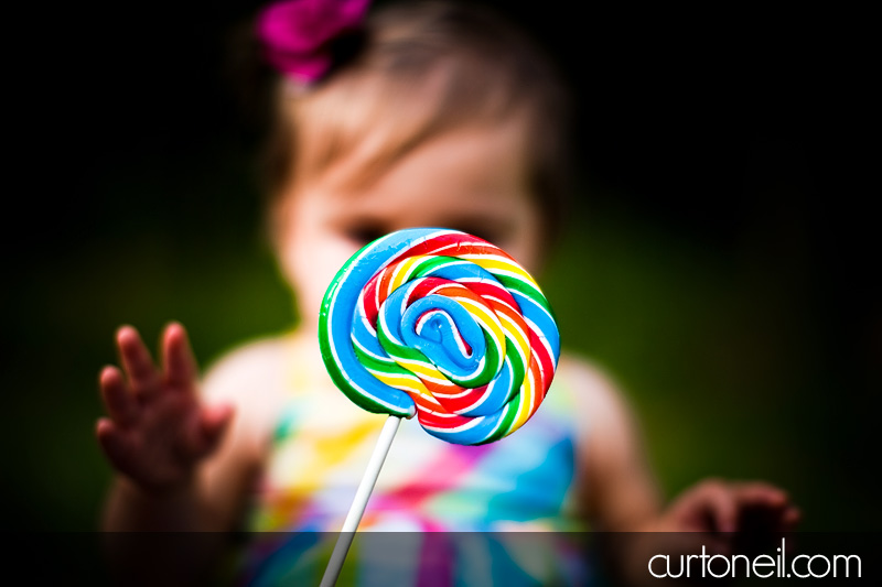 Macy at 9 months - baby photography - giant lollipop
