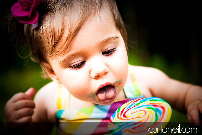 Macy at 9 months - baby photography - giant lollipop