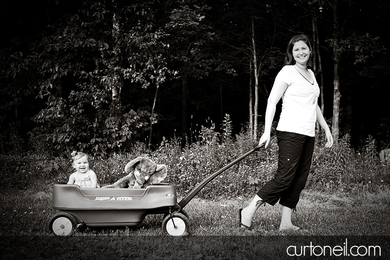 Macy at 9 months - baby photography - mom pulling Macy in the wagon