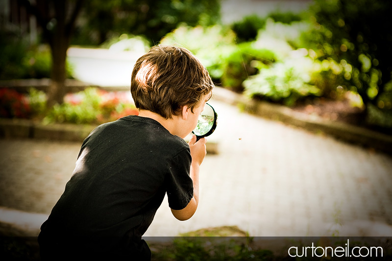 Newborn photography - Charlie - big brother and magnifying glass