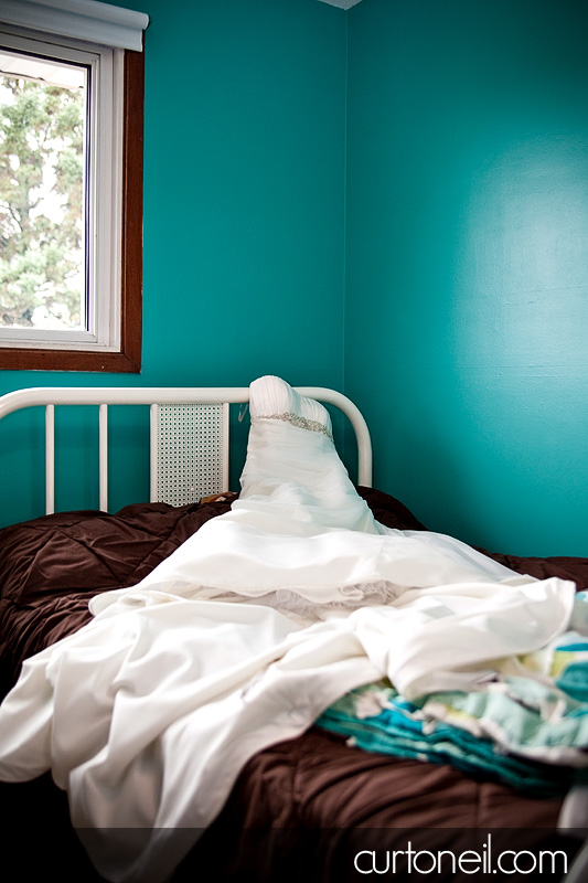 Sault Wedding - wedding dress on bed