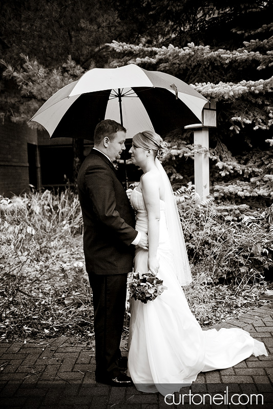 Sault Wedding - umbrella in the rain