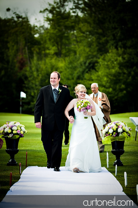Sault Ste Marie Wedding - Katie and Paul - bride and groom walking down aisle