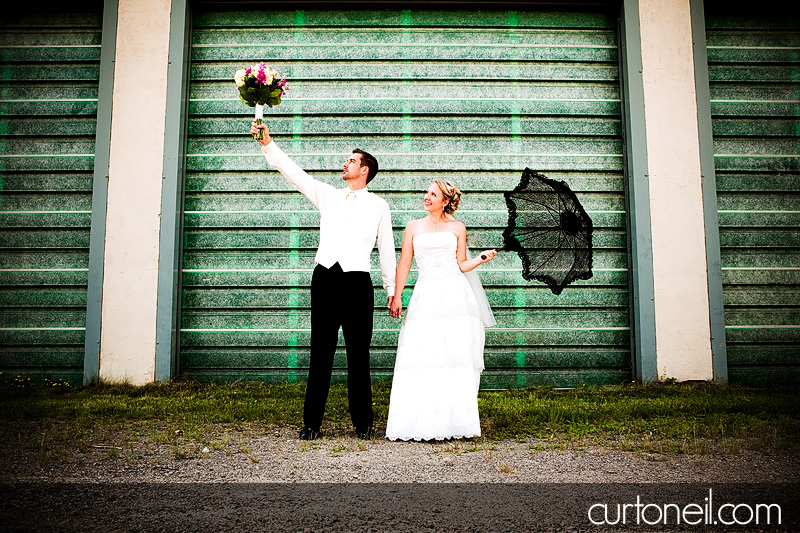 Sault Wedding Photography - Laura and John - Sneak peek, umbrella and bouquet