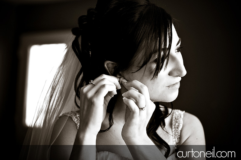 Winter Wedding - putting on earring - Curt O