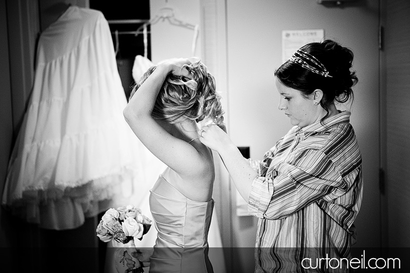 Sault Ste Marie Wedding - Mel and Tim - bride helping bridesmaid