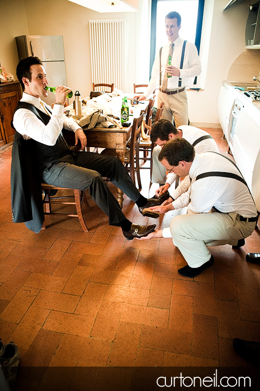 Aaron getting some help getting ready at Borgo Iesolana - Bucine Tuscany Italy wedding