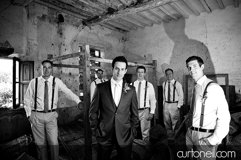 groom and groomsmen in a storage room at abandoned church - Bucine Tuscany Italy wedding