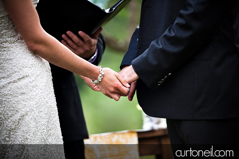 holding hands during ceremony - Bucine Tuscany Italy wedding