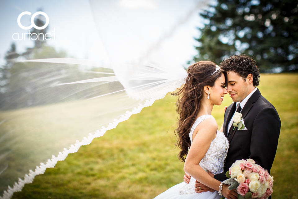 Emma and Anthony - Sault Wedding - sneak peek - Climbing a hill at Bellevue Park