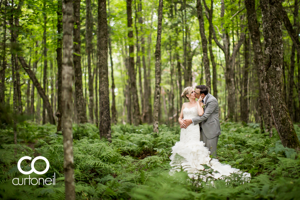 Jessyka and Eric Sault Wedding sneak peek under the canopy in the rain