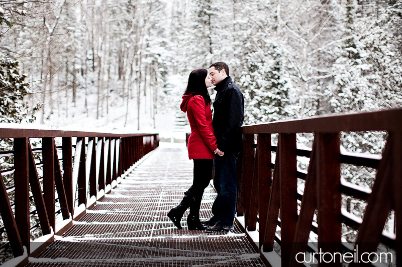 Sault Ste Marie Engagement Photography - Ange and Steve - sneak peek at Fort Creek on a metal bridge in winter