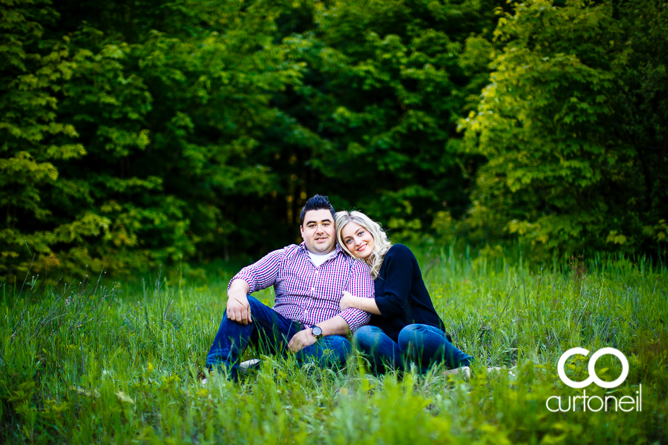 Kara and Tyler - Engagement sneak peek, sitting in field